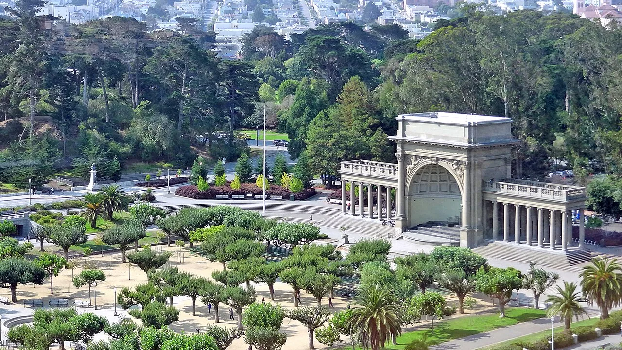 Elevated view of the Spreckels Temple of Music surrounded by trees and landscaped paths in Golden Gate Park.